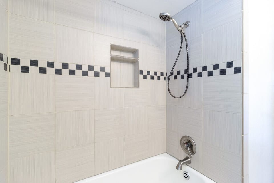 Tub shower in shared hall bathroom
