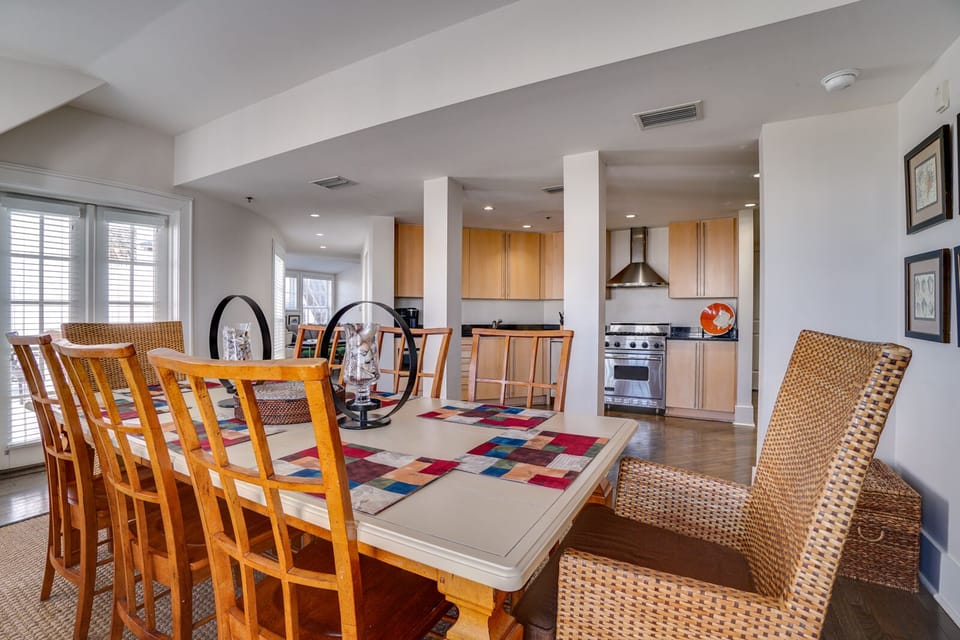 Gather around your spacious dining table where memorable meals come to life, with a modern kitchen ready for culinary adventures.