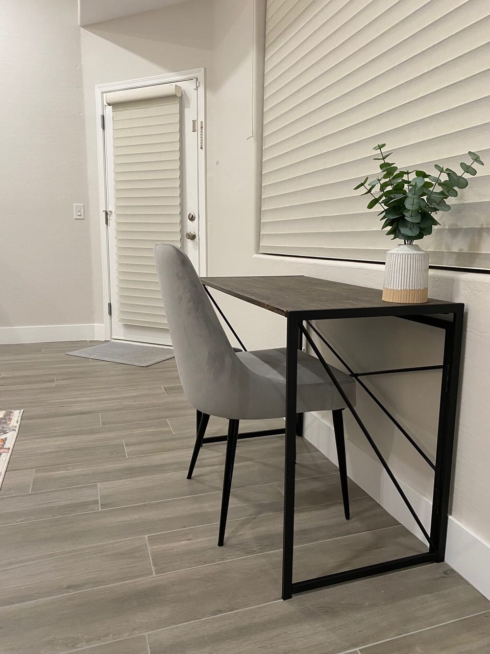 A dedicated workspace has been added to the primary bedroom with views directly overlooking the pool. 