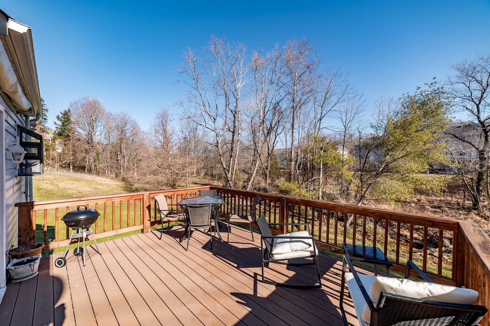 Back deck in winter. Charcoal grill, outdoor dining & rocking chairs.