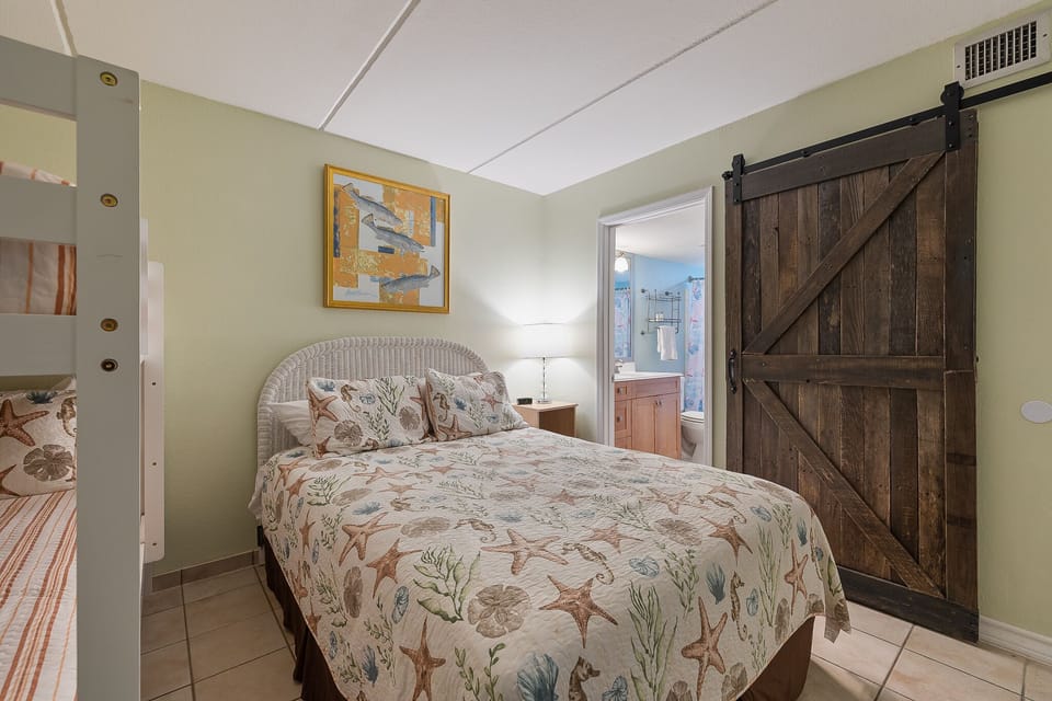 The combination of a full bed and bunk beds offers plenty of room to unwind.