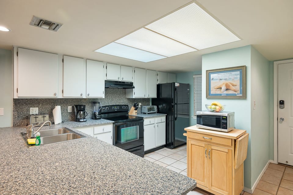 Prepare everything from quick breakfasts to family dinners in the fully stocked kitchen.