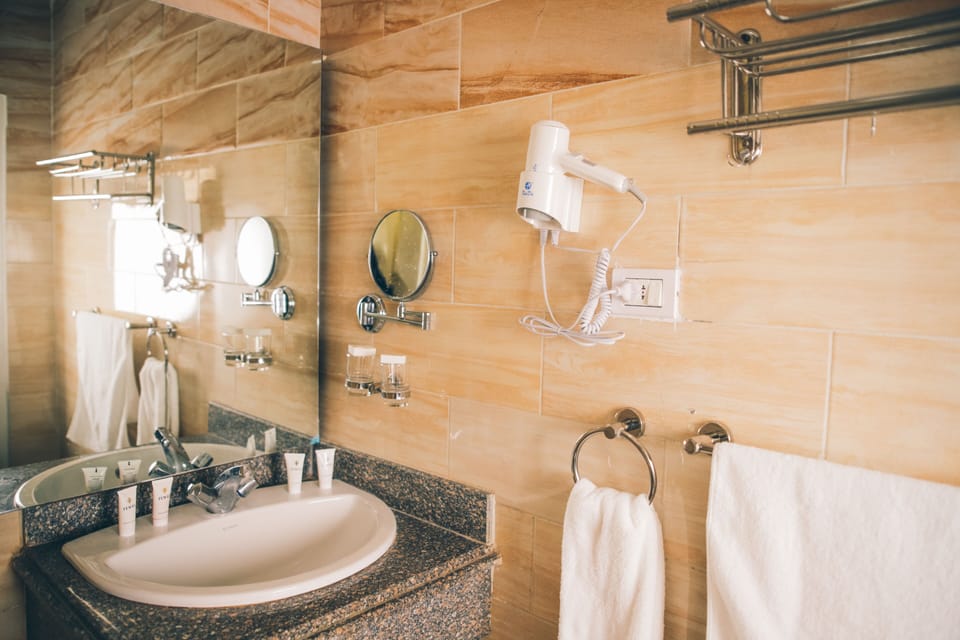 Bathtub, hair dryer, bathrobes, bidet