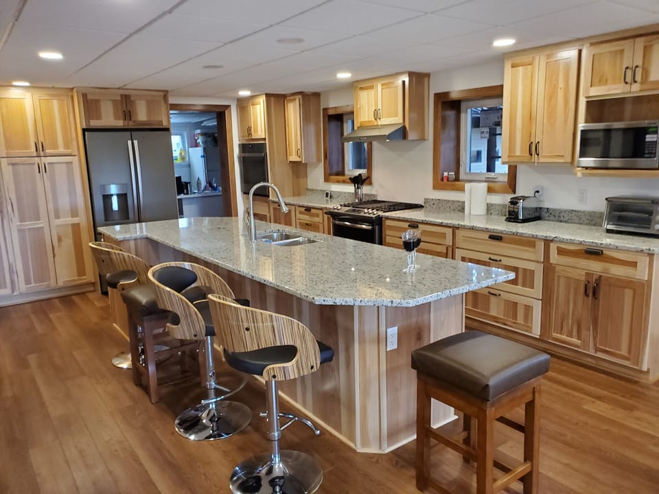 An Epicurean Kitchen awaits you with a large adjoining dining area