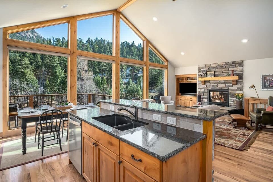 Center island with sink and dishwasher.