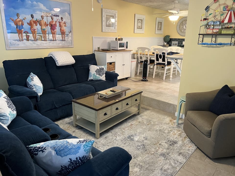 Relax in the living room with comfortable reclining sofas.