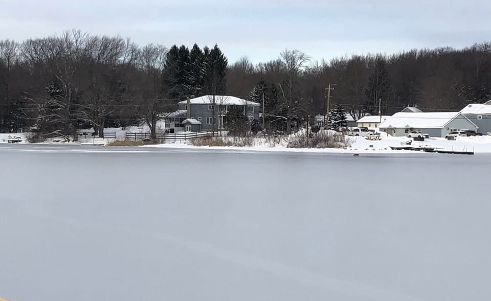 View of the house from the frozen lake 