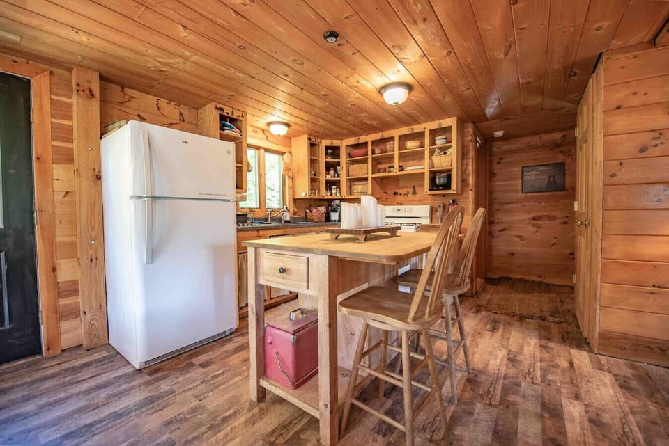 Inviting kitchen area with bar seating and open design for family gatherings.
