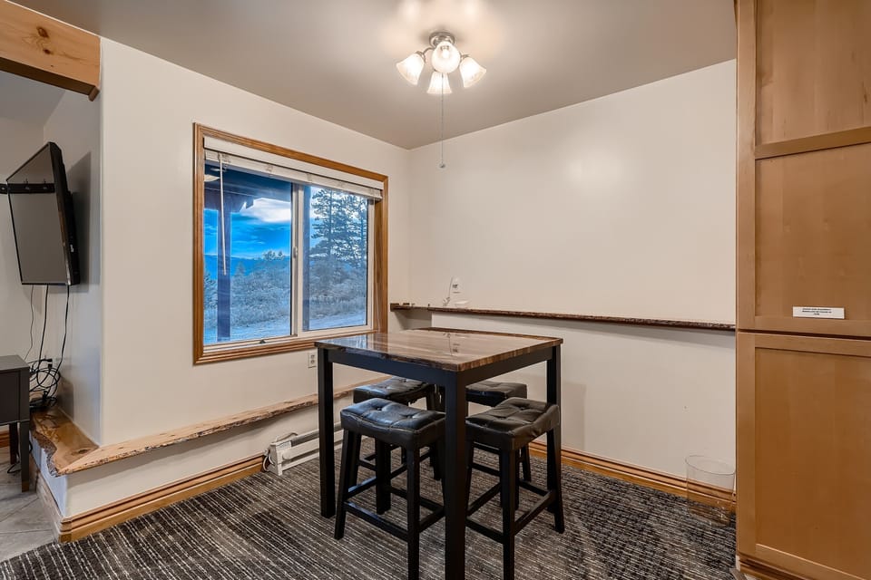 A high-top table in the game room, perfect for gathering with friends or family during game time!