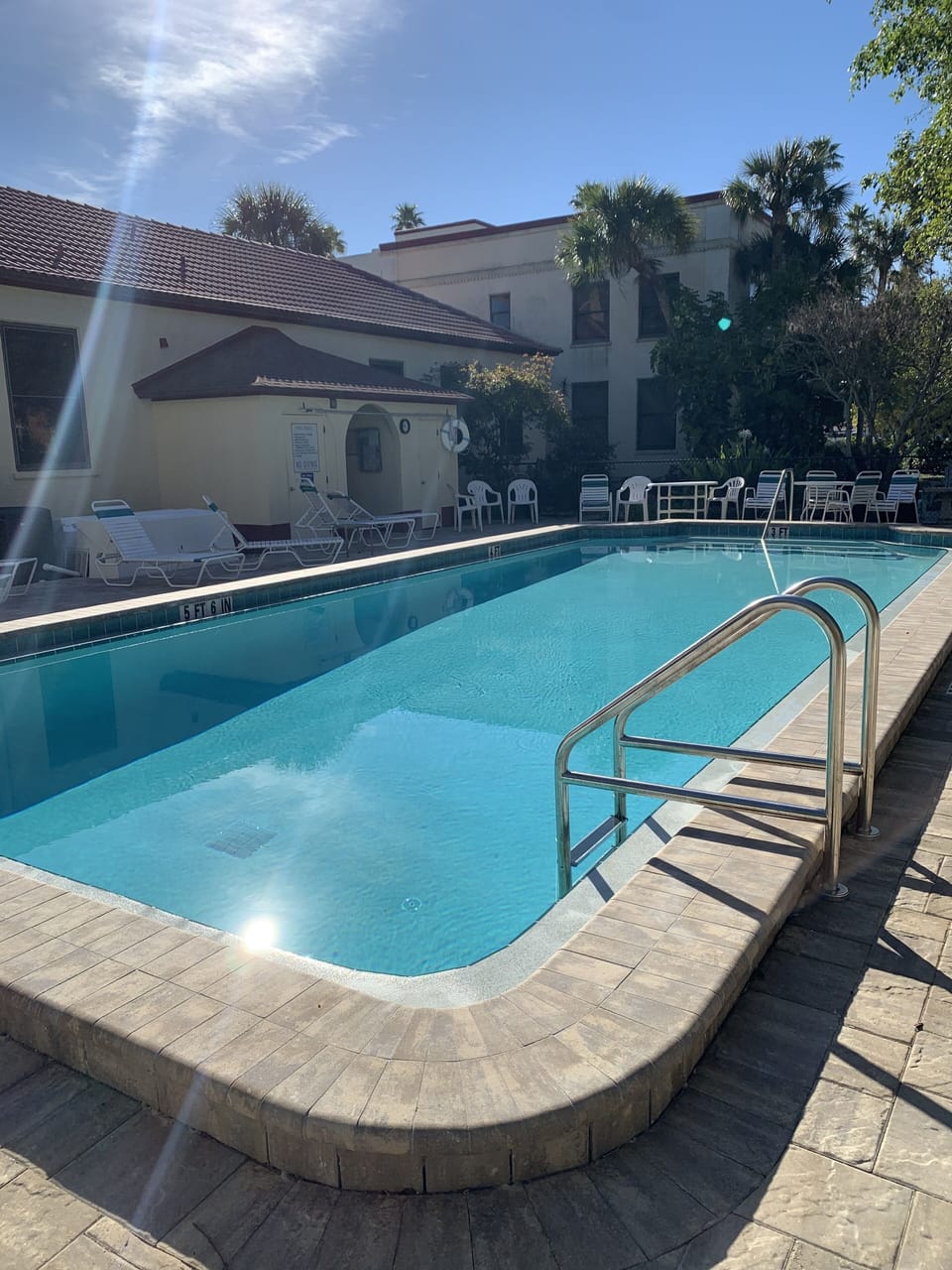 Outdoor pool, clubhouse to the left