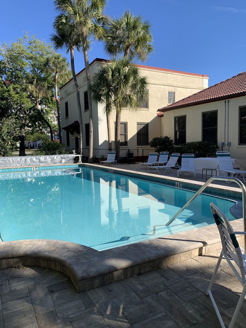 Outdoor pool, clubhouse to the right