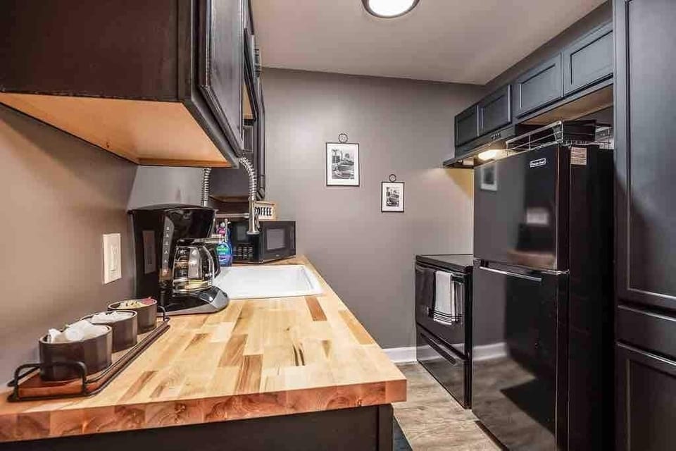 Kitchen with butcher block countertops. 