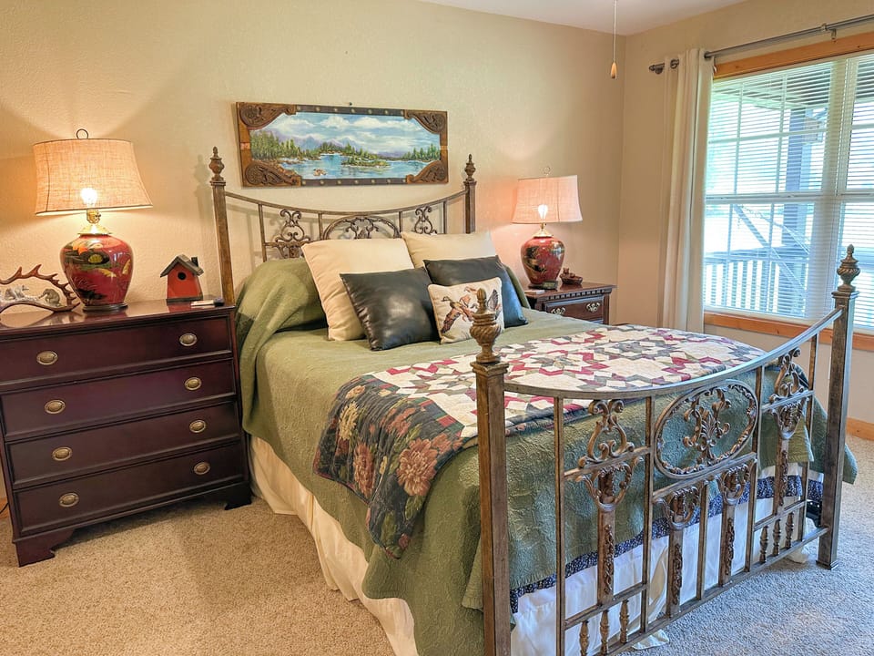 Bedroom 1-Primary suite with queen bed, private bathroom, and access to & porch