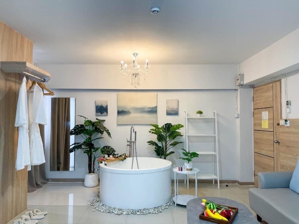 Premium Room, 1 King Bed, Non Smoking, Bathtub | Living area | 50-inch Smart TV with cable channels, TV