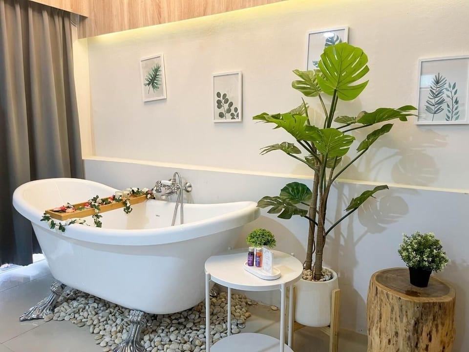 Premium Room, 1 King Bed, Non Smoking, Bathtub | Living area | 50-inch Smart TV with cable channels, TV