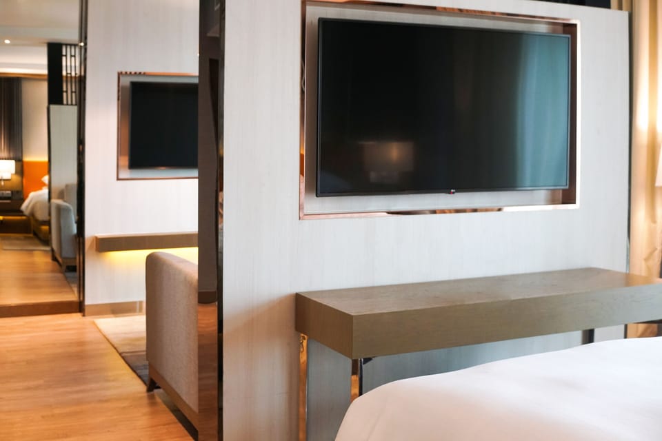 Junior Suite, 1 Bedroom, Smoking | Living room | 48-inch flat-screen TV with satellite channels, TV, toys
