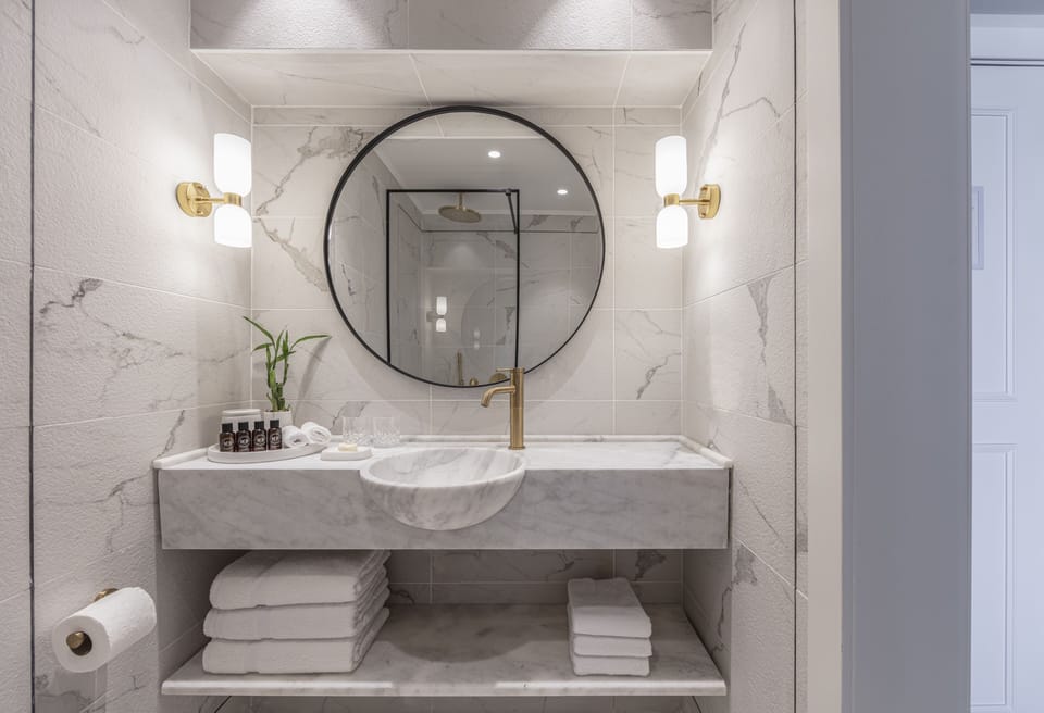 Kinneret Room With Balcony | Bathroom | Hair dryer, towels