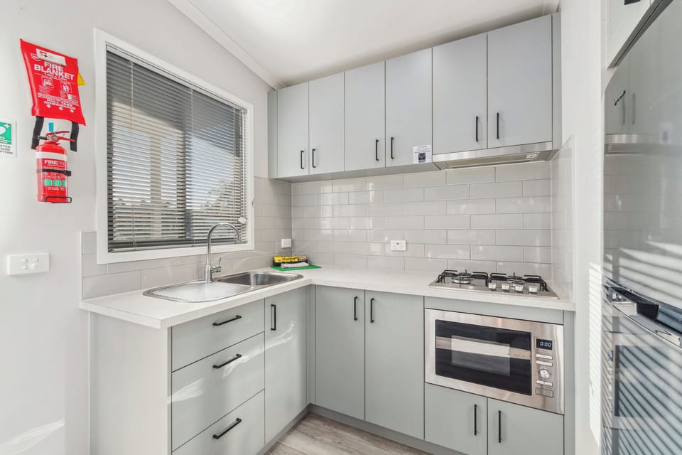 Superior 2 Bedroom Cabin | Private kitchen | Full-size fridge, microwave, oven, stovetop