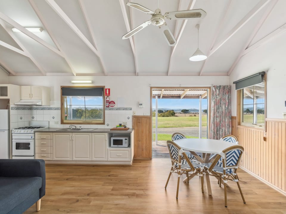 Standard Oceanfront 2 Bedroom Cabin | Living area | 32-inch flat-screen TV with satellite channels, table tennis