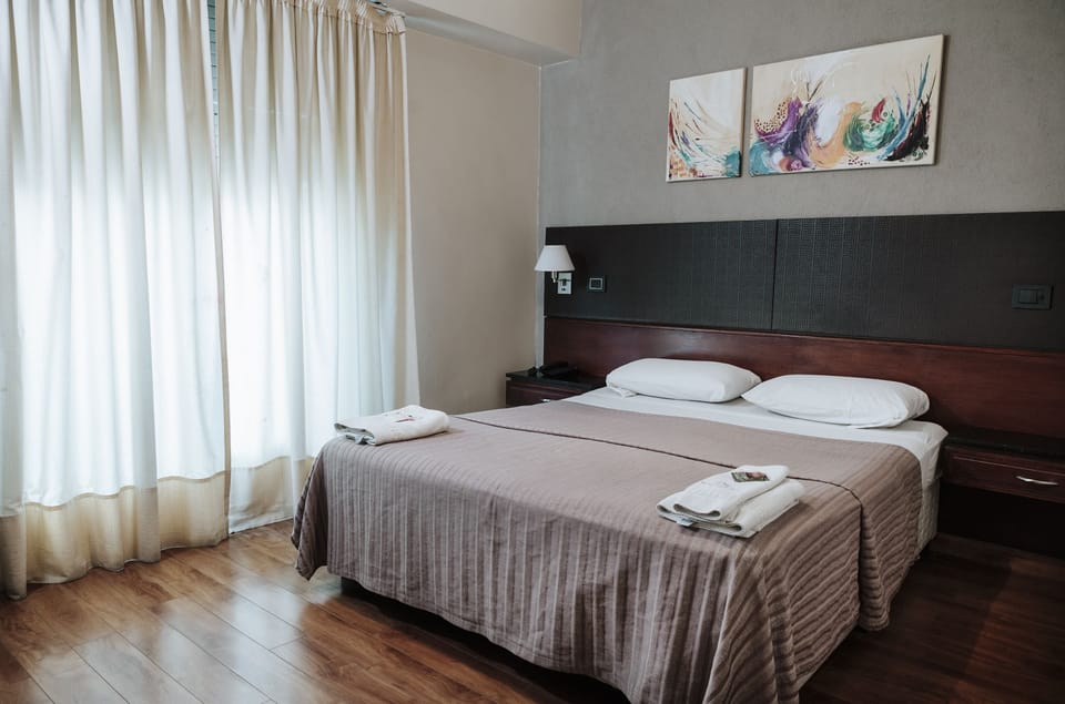 Down comforters, pillowtop beds, in-room safe, desk