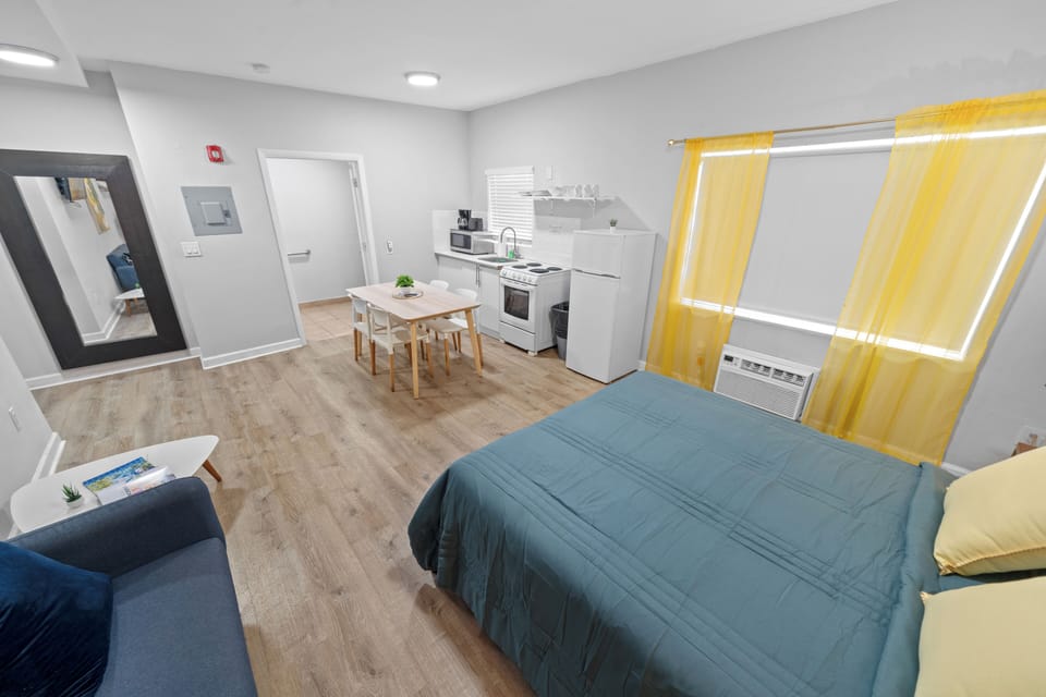 Deluxe Accessible Queen Studio w/ Kitchen & Sofa Bed | Down comforters, individually decorated, individually furnished
