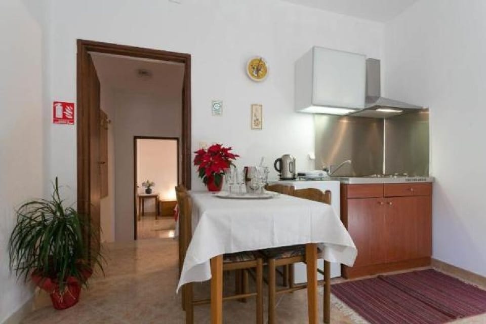 Apartment (One-Bedroom Apartment with Balcony) | Private kitchen | Fridge
