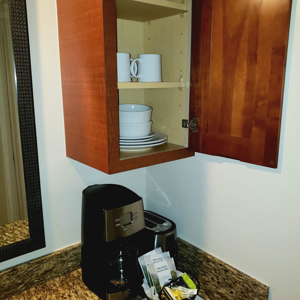 Sturdy cups, plates, bowls, nice coffeemaker.  Coffee furnished.