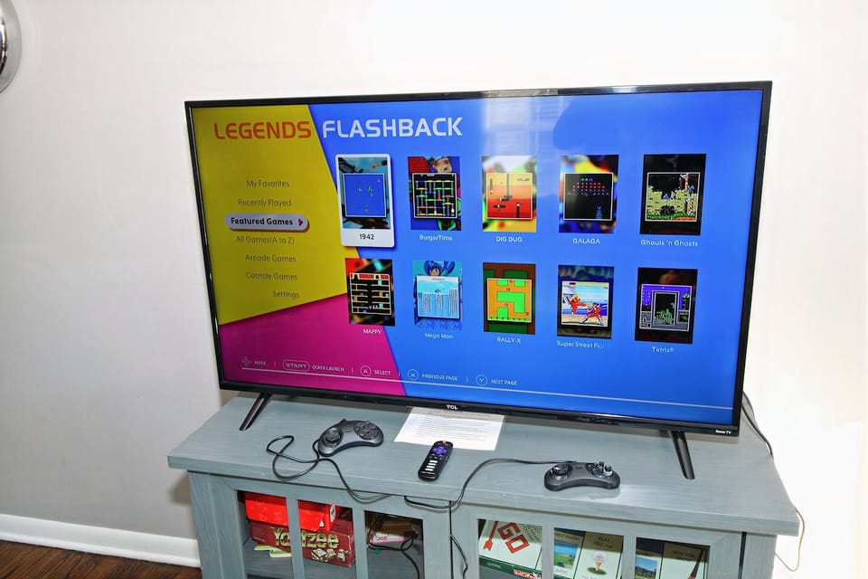 Smart TV in living room has a video game system with hundreds of games