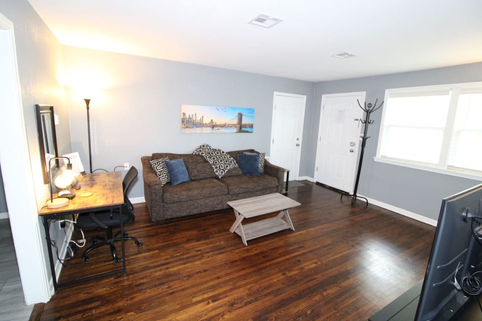 Living room has a desk for working or to use as a vanity