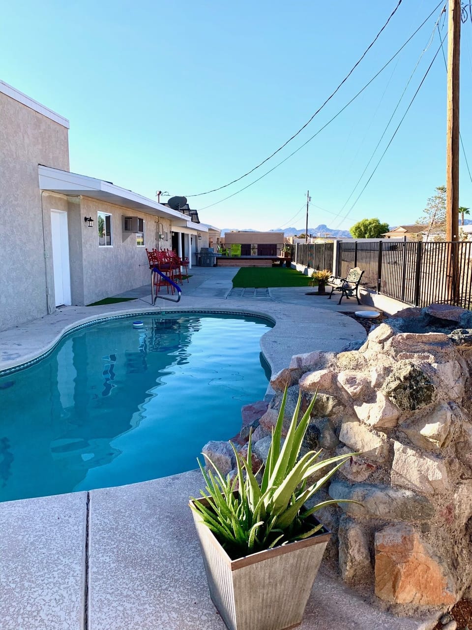 The huge backyard has a pool and deck, perfect for entertaining. 