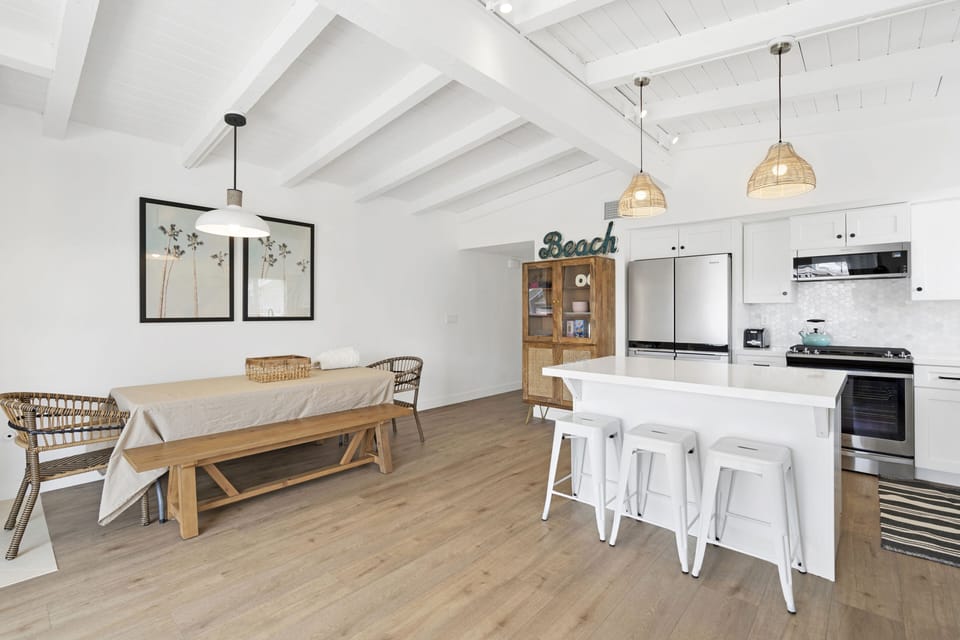 Upstairs - great dining space for 8 people plus kitchen island seats 3.  
