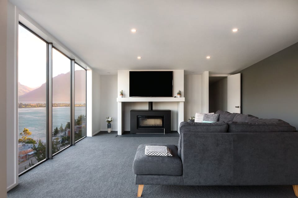 Entertainment lounge with large warm log burner.