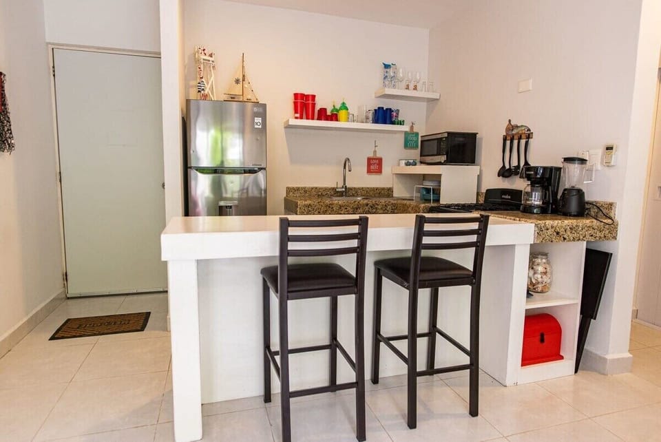 A spacious living-room, with an open kitchen concept for more air and light flow.
