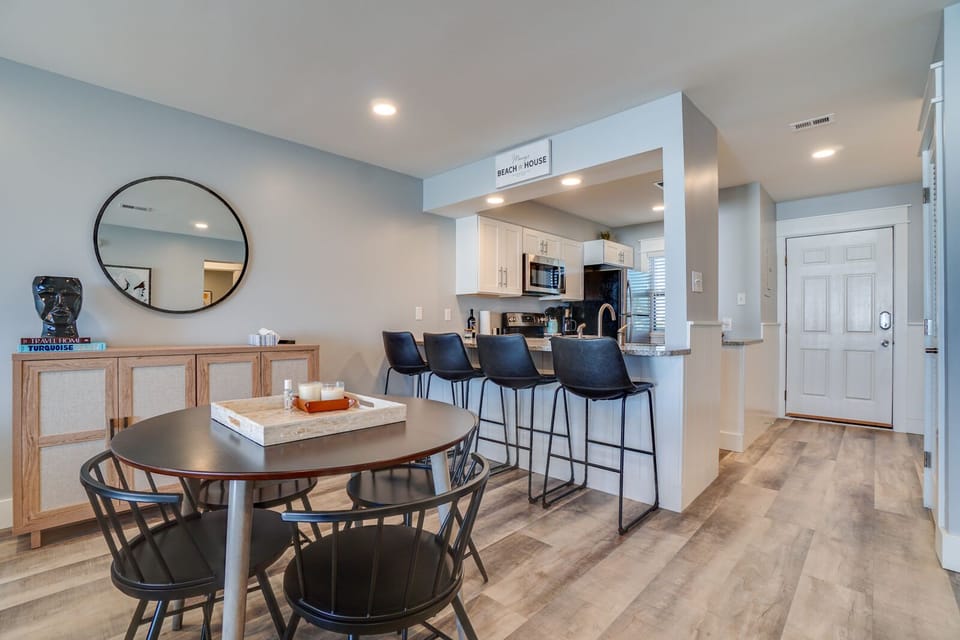 Gather around your sleek dining table or cozy up at the breakfast bar while savoring coffee in this bright, modern space.