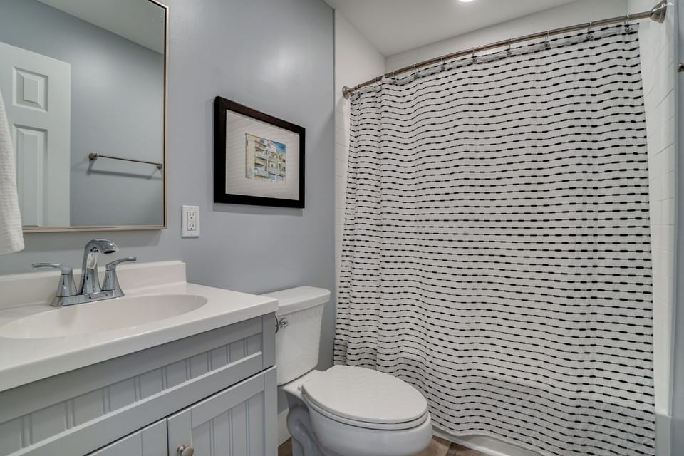 Refresh in your private bathroom with modern finishes and a spacious shower.