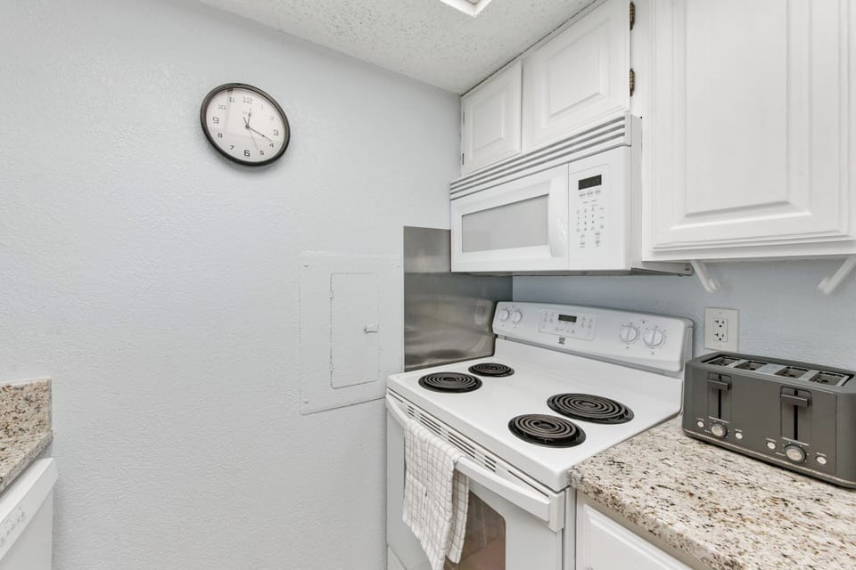 Your fully equipped kitchen features everything you need, from the microwave and stove to the toaster, making home-cooked meals a breeze during your stay.