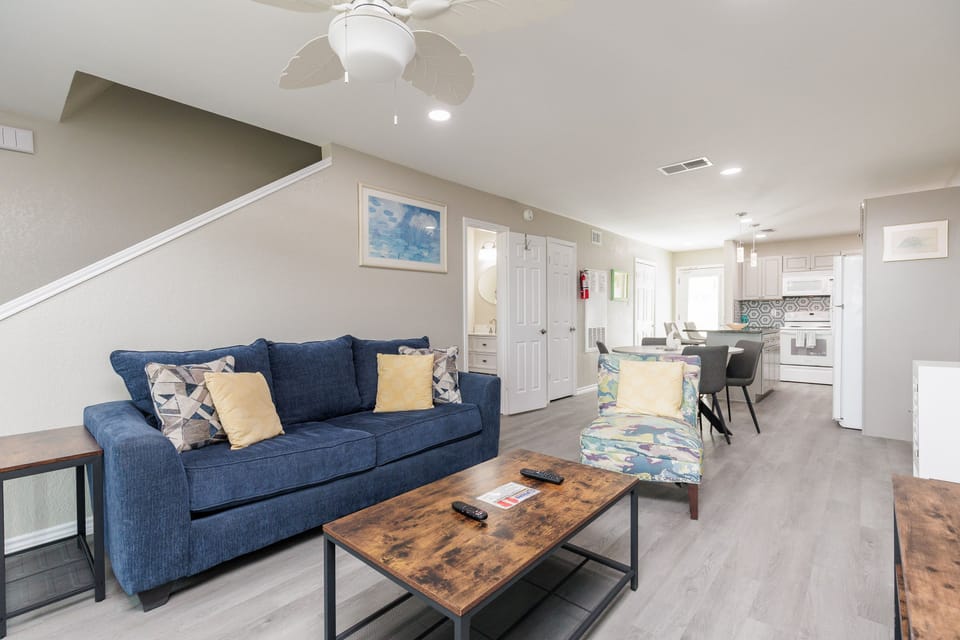 Relax in your spacious open-concept living area with comfortable seating, modern kitchen, and thoughtful touches that make you feel right at home.