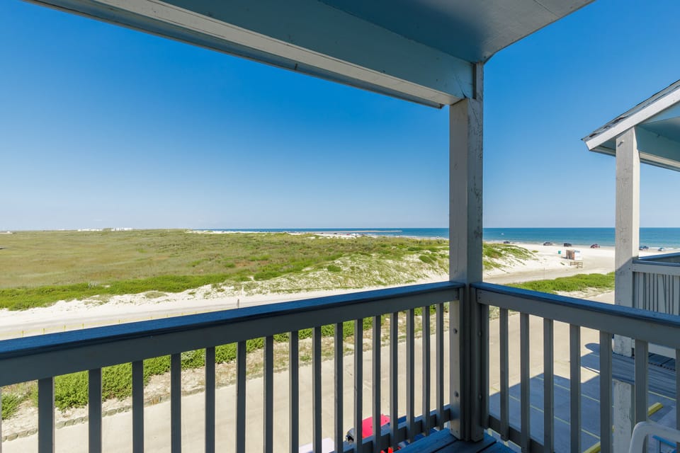 Wake up to endless ocean views from your primary bedroom balcony