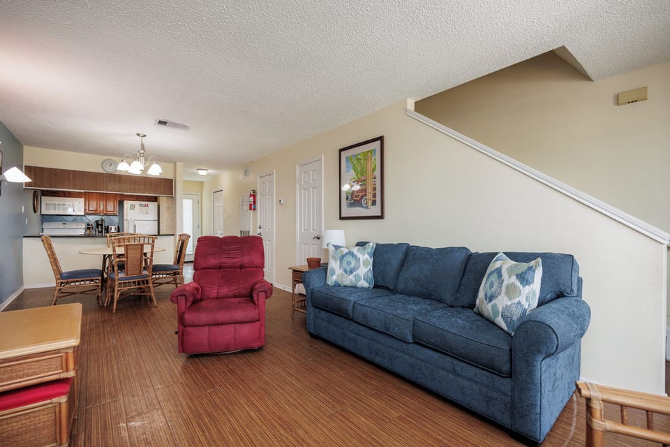 Relax in your spacious open-concept living area, where comfortable seating and a well-equipped kitchen create the perfect home base for your getaway.