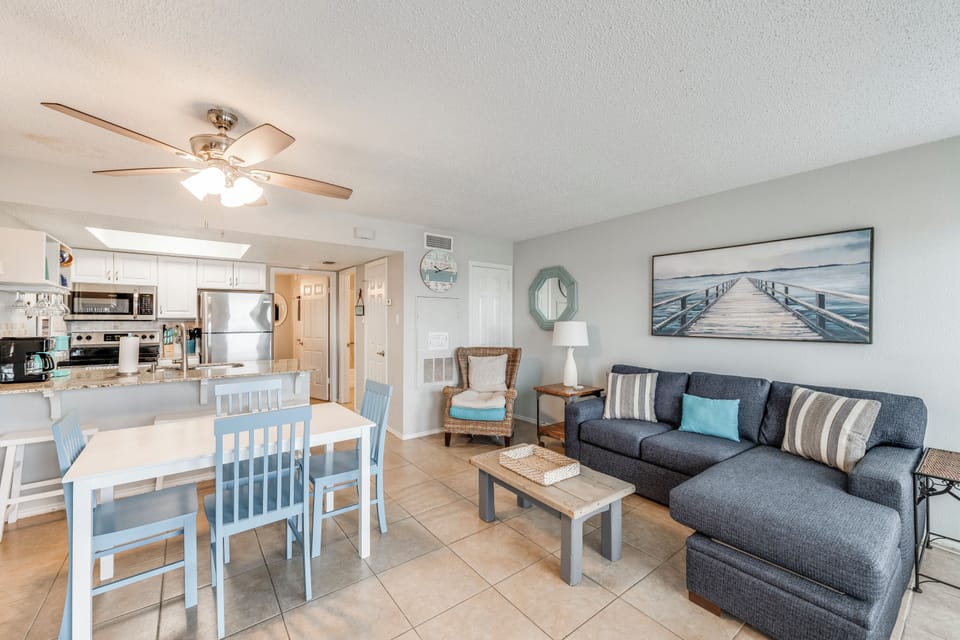 Relax in your coastal-inspired living space with comfortable seating, dining for four, and a fully-equipped kitchen—perfect for memorable vacation meals together.
