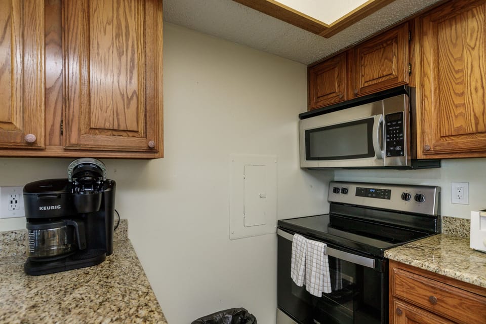 Your fully equipped kitchen features granite counters, stainless appliances, and everything needed for home-cooked meals during your stay.