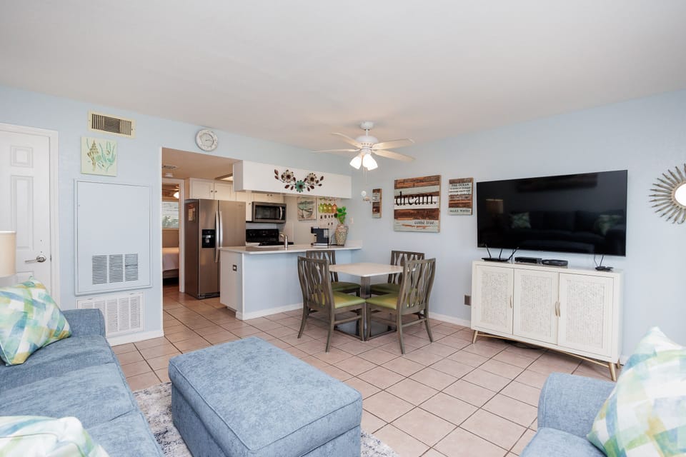 Relax in your bright, open-concept space where kitchen, dining, and living areas flow seamlessly together for comfortable coastal living.