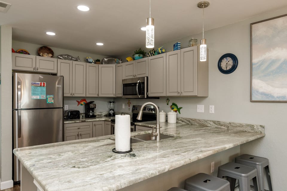 Your fully equipped kitchen features beautiful granite countertops, stainless steel appliances, and everything you need to cook memorable meals.