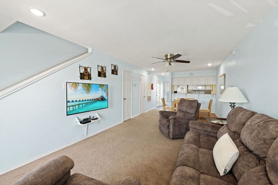 Your spacious living area features vaulted ceilings, plush seating, and an open flow to the kitchen—perfect for relaxing or gathering with family and friends after a day of adventure.