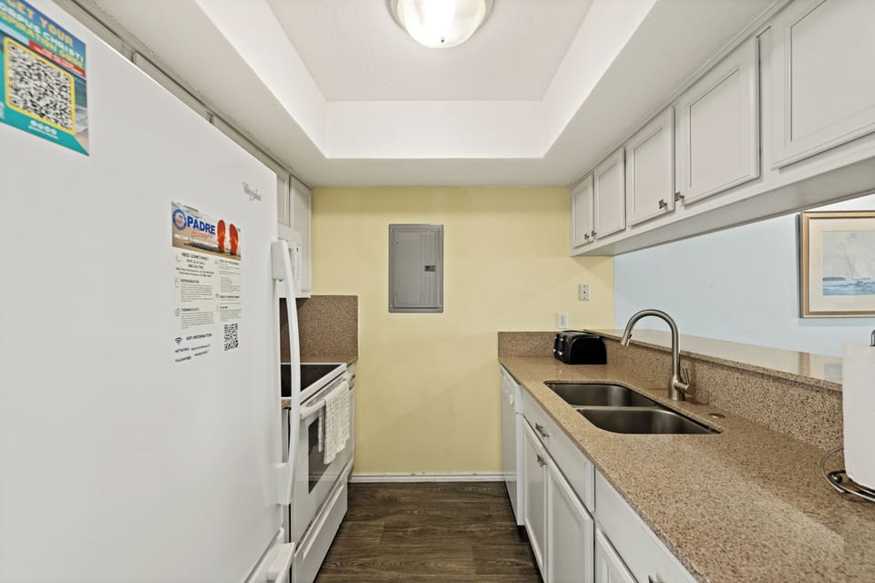 Your fully equipped kitchen awaits with everything you need to prepare meals during your stay. Ample counter space, a double sink, and modern appliances make cooking a breeze.