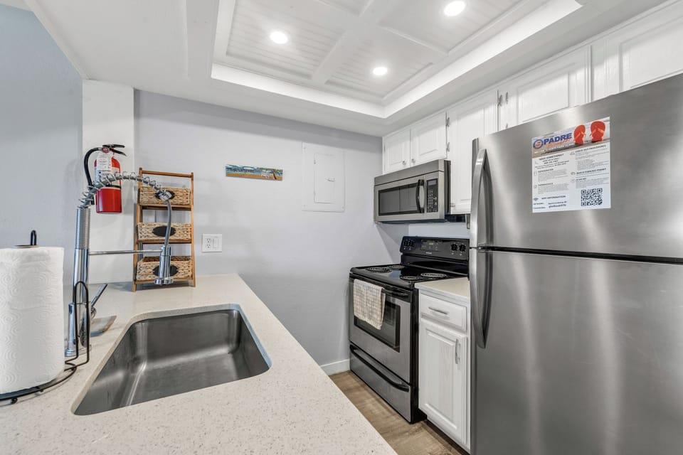 Your fully equipped modern kitchen features sleek appliances and plenty of counter space for preparing memorable vacation meals.
