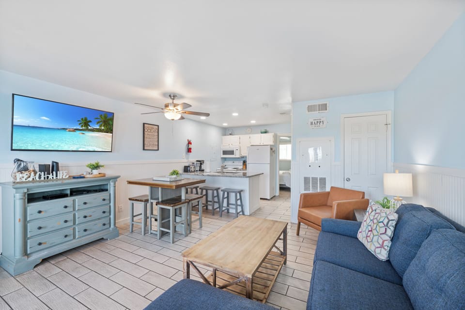 Your bright, open-concept retreat features coastal charm with comfortable seating, full kitchen, and beach vibes throughout.