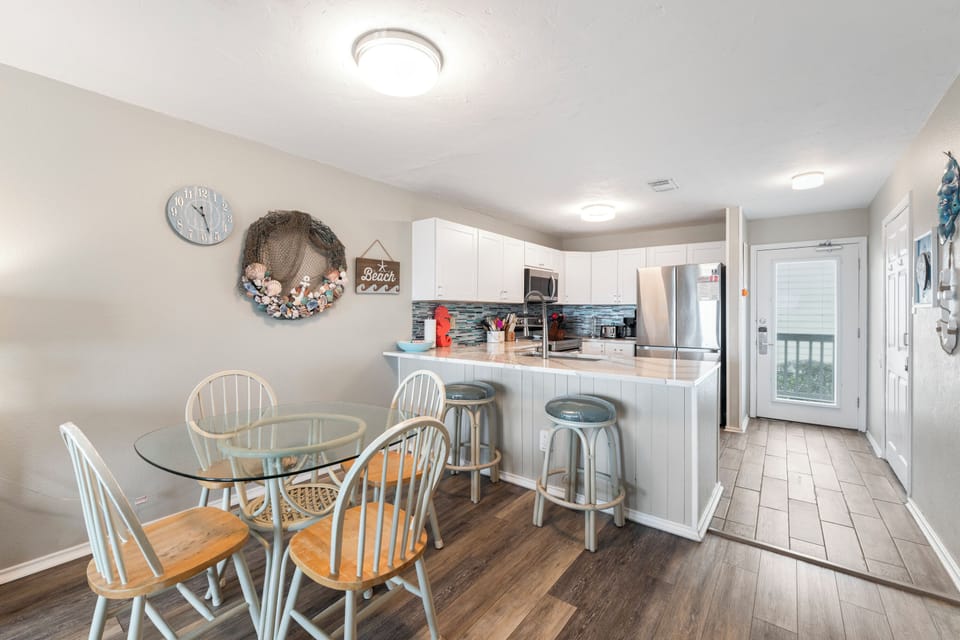 Your open-concept kitchen flows seamlessly into the dining area, creating the perfect space for morning coffee and evening meals together.