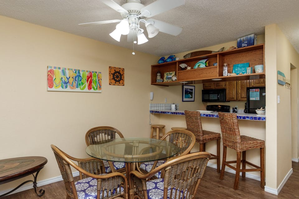Your bright dining area flows seamlessly into the fully equipped kitchen, perfect for sharing meals and morning coffee together.