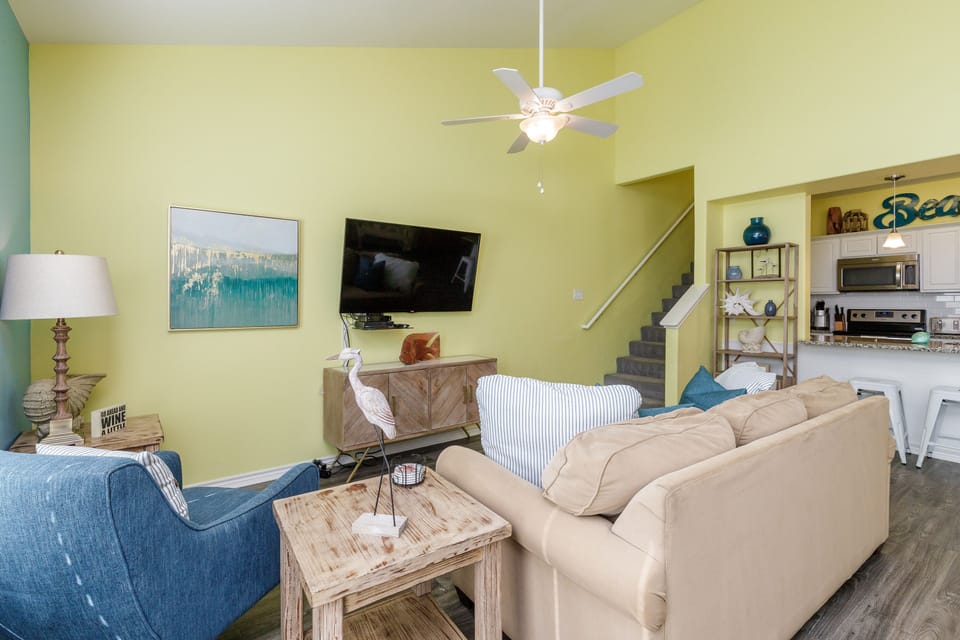 Unwind in your bright, open living space with comfortable seating and coastal charm throughout.
